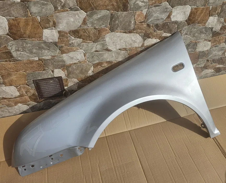 Aripa stanga fata NOUA vopsita ARGINTIU cod LA7W Volkswagen Bora an 1998 1999 2000 2001 2002 2003 2004 2005