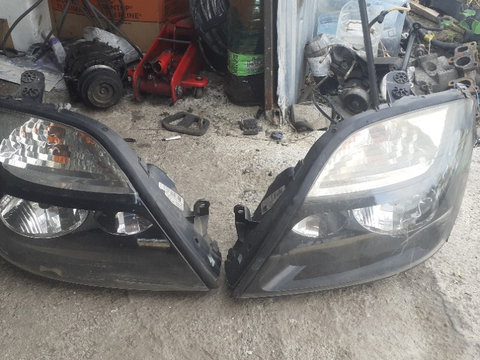 Faruri renault scenic 1 cu negru anul 2002