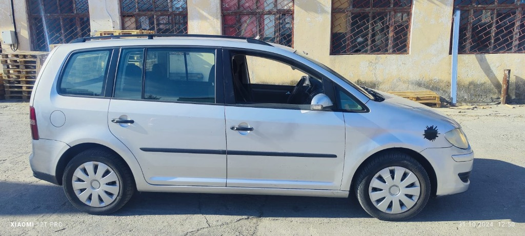 Suport etrier Vw Touran 1.9 TDI 105CP / 77 KW cod motor BLS transmisie manuala 6+1 cod JYK an 2008