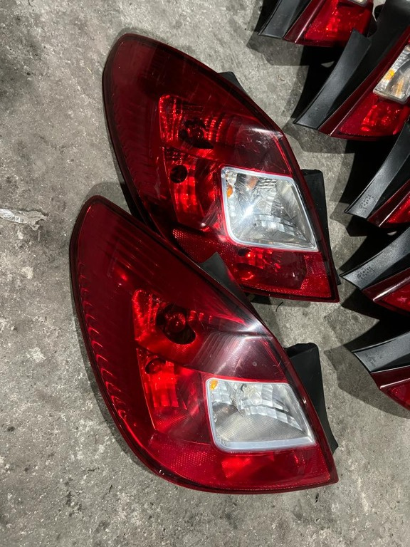 Tripla / Lampa spate Opel Corsa D stanga ( 4 usi )
